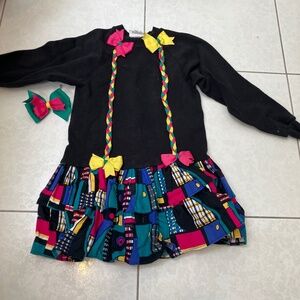 Adorable girls dress. With matching bow.